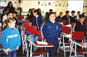 Alamos children in 110 year old school greet visitors with songs and poetry.