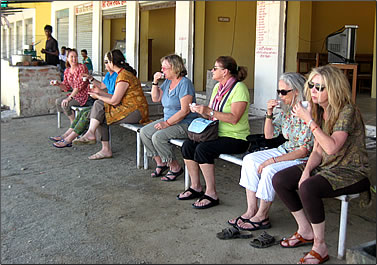 Chai break at truck stop, women travel groups in India.