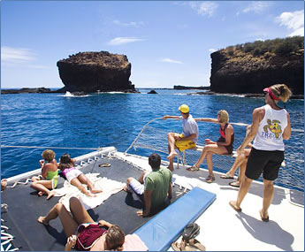 Trilogy Excursions catamaran approaches Lanai, Hawaii.