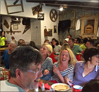 Dinner at Alps refugio while trekking Tour du Mont Blanc: France, Switzerland and Italy.