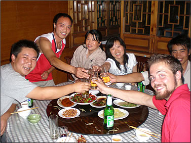 Celebration dinner with staff and volunteers at a Panda conservation reserve in China.