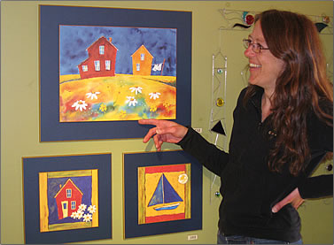 Artist Francine Bourque paints colorful houses on Les Iles de la Madeleine, Quebec Magdalen Islands travel.
